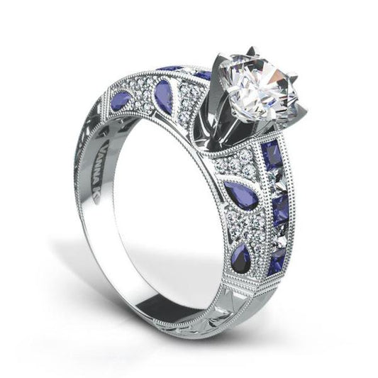 18K WHITE GOLD ENGAGEMENT RING WITH DIAMONDS AND SAPPHIRES